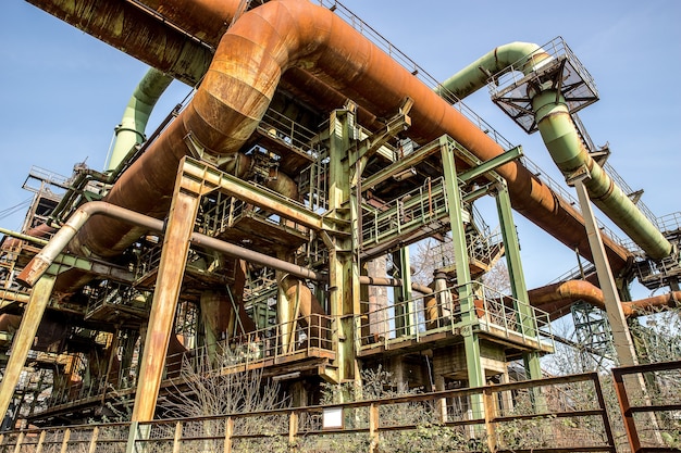 metal pipes and structures with a clear blue sky