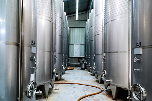 Metal wine storage tanks in a winery