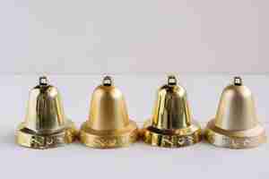 Free photo metallic bells on light table