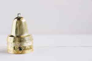 Free photo metallic bells on white table