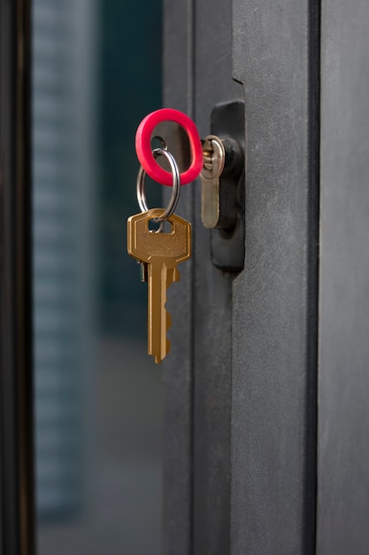 Free photo metallic key in door lock