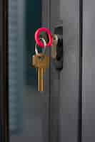 Free photo metallic key in door lock