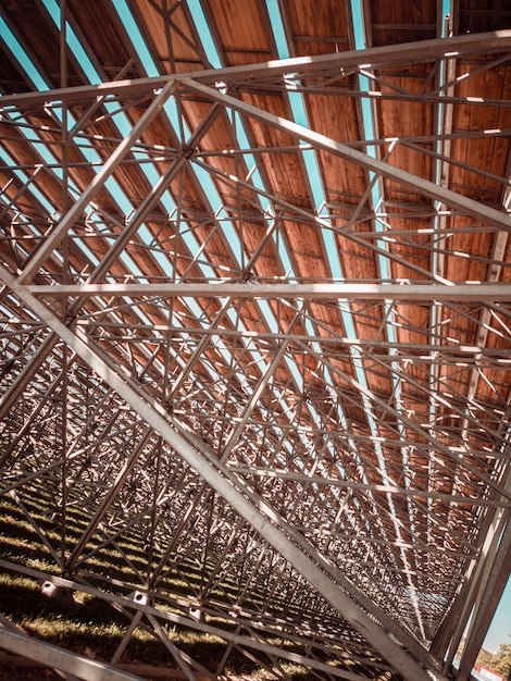 Metallic structure with wooden ceiling