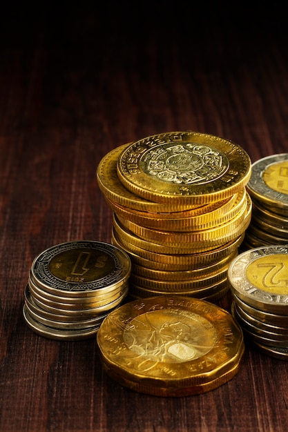 Mexican coins arrangement on table high angle