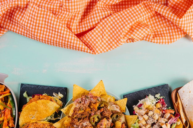 Free photo mexican food near checkered tablecloth