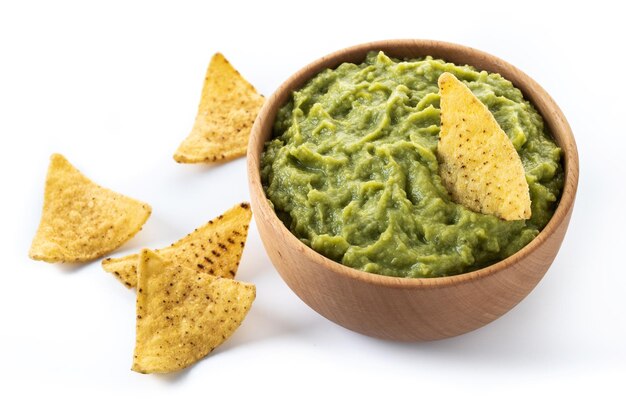 Mexican guacamole with nacho chip isolated on white background