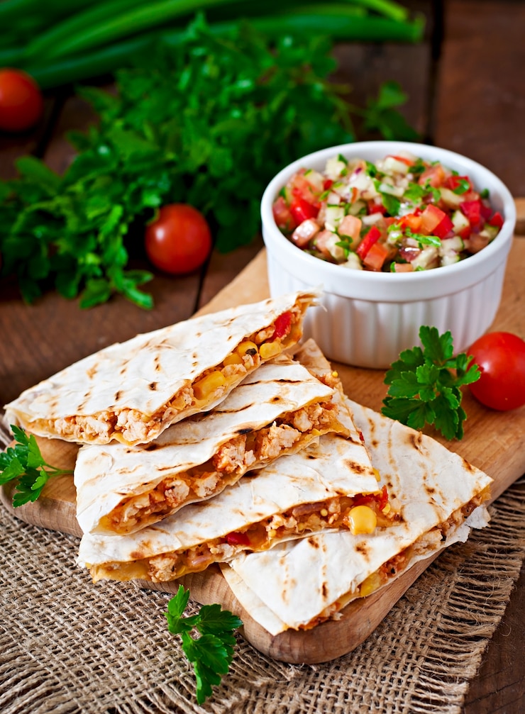 Free Photo mexican quesadilla wrap with chicken, corn and sweet pepper and salsa