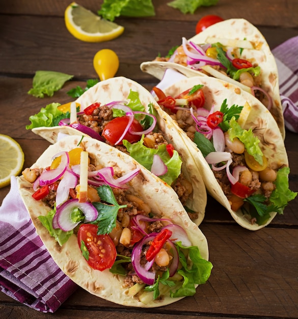 Mexican tacos with meat, beans and salsa