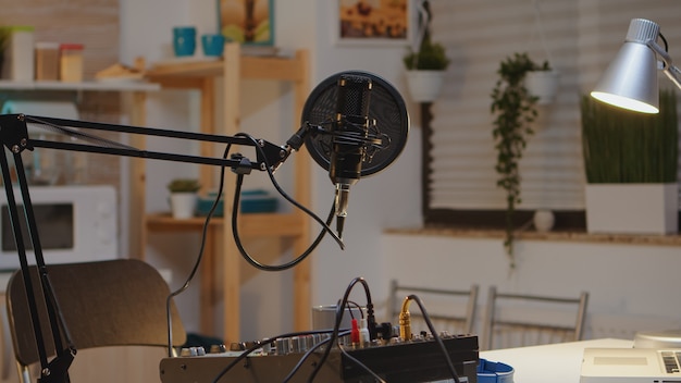 Microphone and mixer for podcast of famous influencer. Recording social media content with production microphone. Digital web internet streaming station