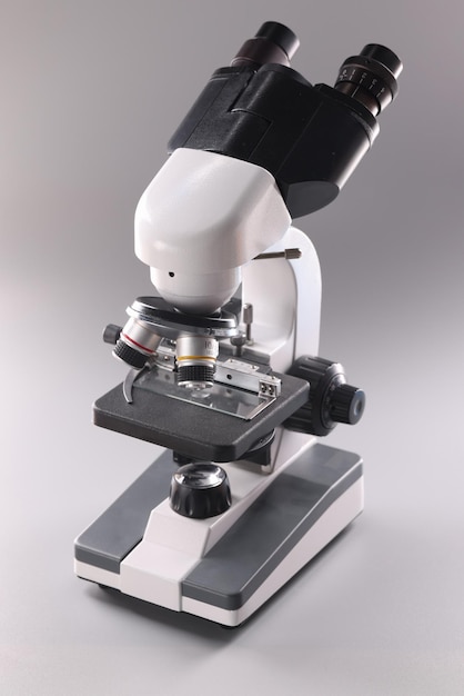 Microscope on gray background microbiology and healthcare