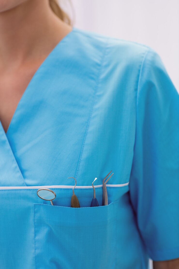Free Photo mid section of dentist carrying dental tools in pocket