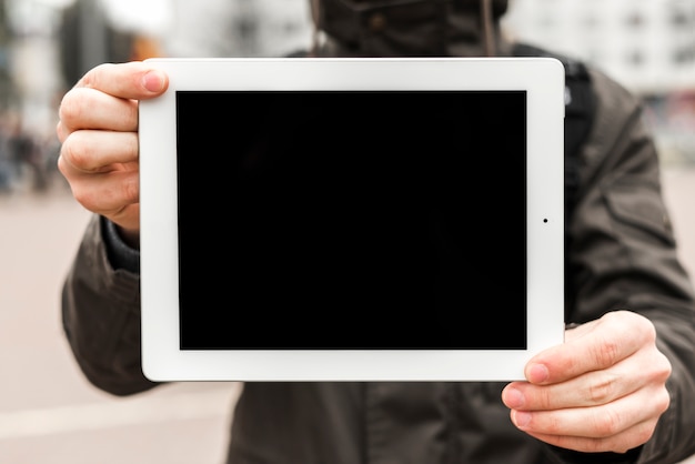 Mid section of a man showing digital display copy space for writing text