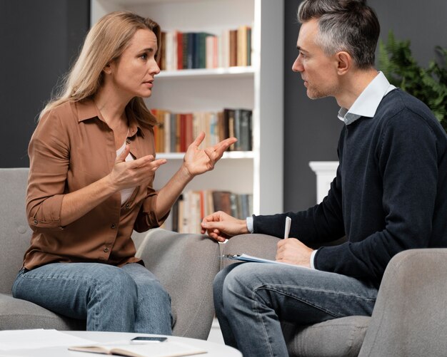 Mid shot counselor talking to patient