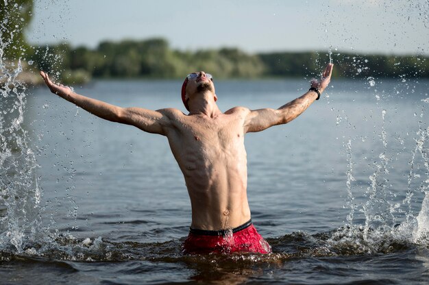 Mid shot swimmer in lake