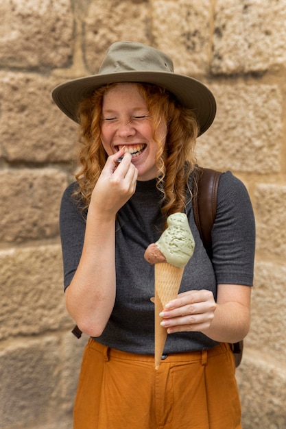 Mid shot woman holding ice cream cone