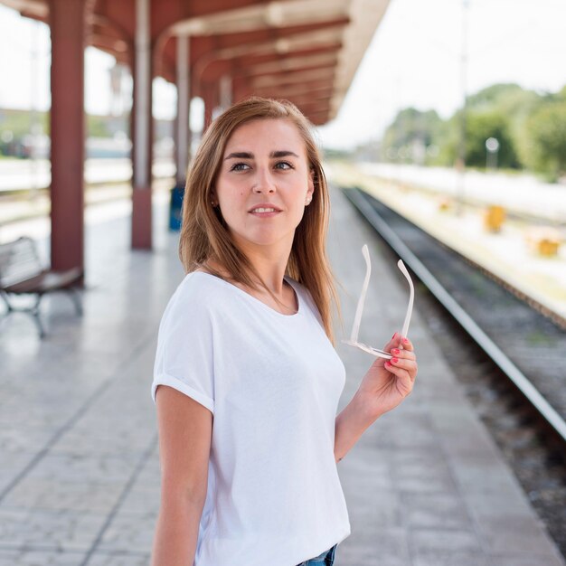 Mid shot woman in train station