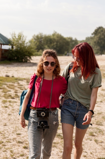 Mid shot women walking together