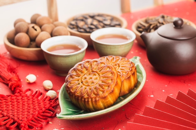 Midautumn festival concept traditional mooncakes on table  with teacup