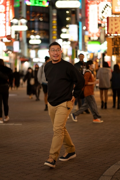 Free photo middle age adult having fun at night