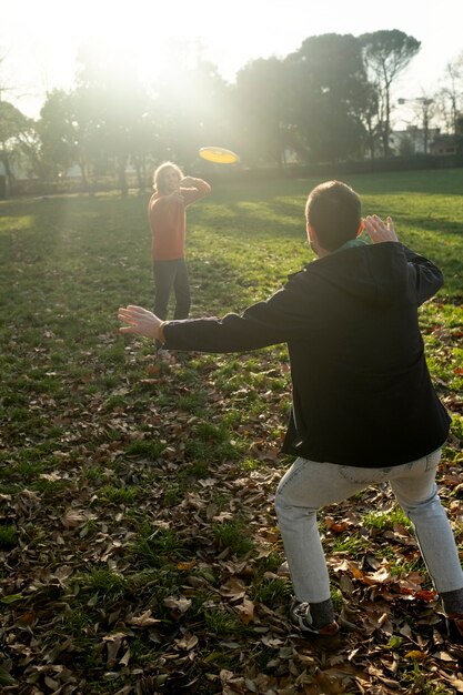 Middle age friends having fun together at picnic