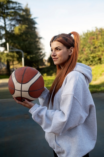 Free photo middle age friends having fun together playing basketball