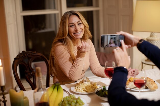 Middle age friends at night having dinner