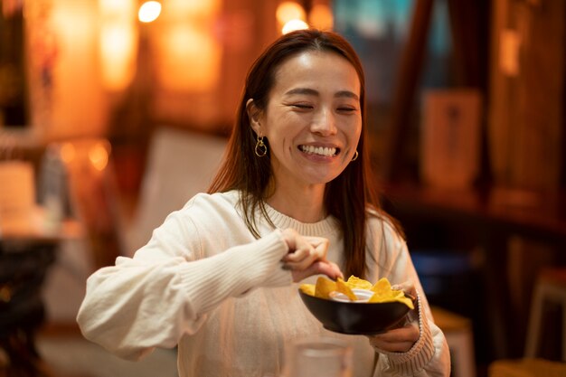 Middle age woman having fun at restaurant