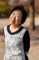 Free photo middle age woman smiling and having a good time