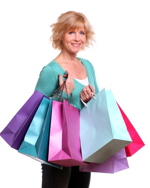 Middle age woman with shopping bags