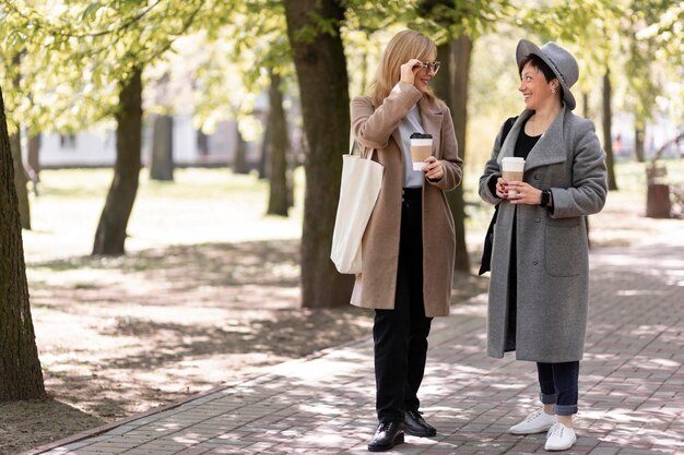 Middle aged best friends spending time together outdoors