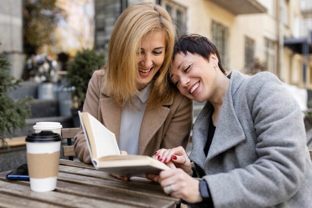 Middle aged best friends spending time together outside