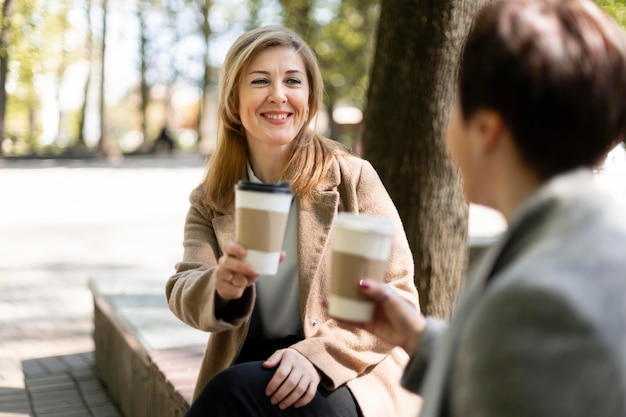 Free photo middle aged best friends spending time together