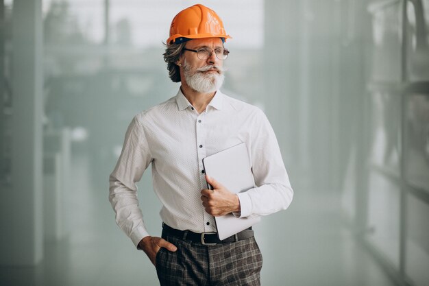 Middle aged business man in a hard hat