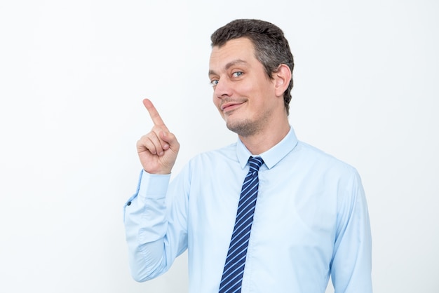 Middle-aged Business Man Pointing at Copyspace