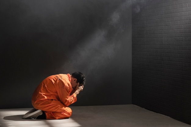 Free photo middle aged man spending time in jail