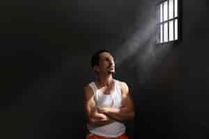 Free photo middle aged man spending time in jail