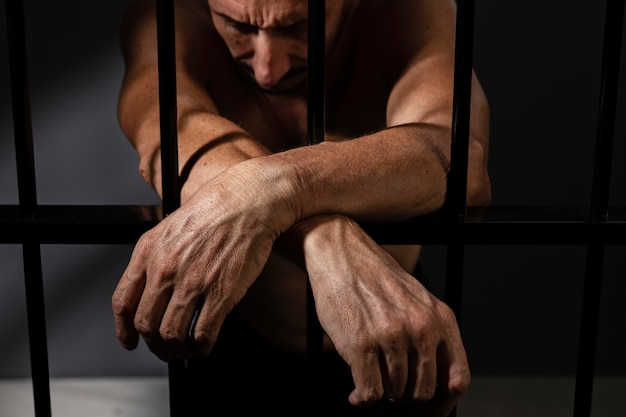 Middle aged man spending time in jail