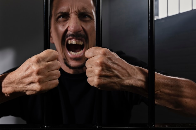 Middle aged man spending time in jail