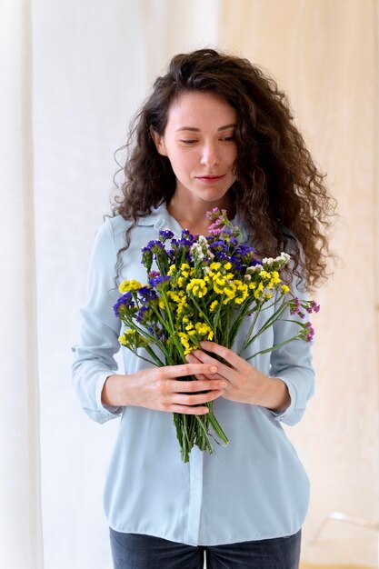 Middle Aged Woman Holding Flowers