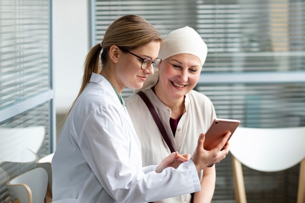 Middle aged woman with skin cancer talking with her doctor