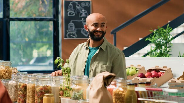 Middle eastern man looks at produce