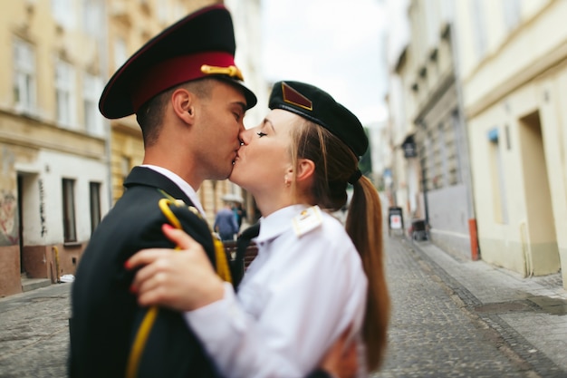 Free photo military loving couple kissing portrait