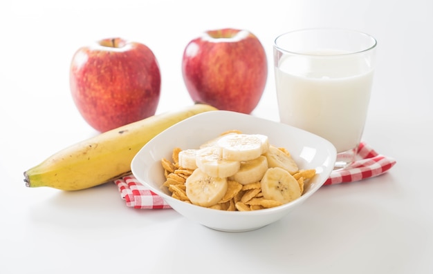 Free photo milk, apple, banana and cornflakes