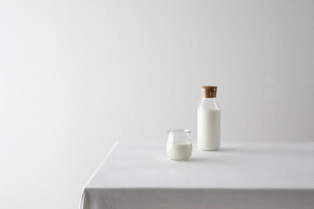 Milk bottle and glass arrangement