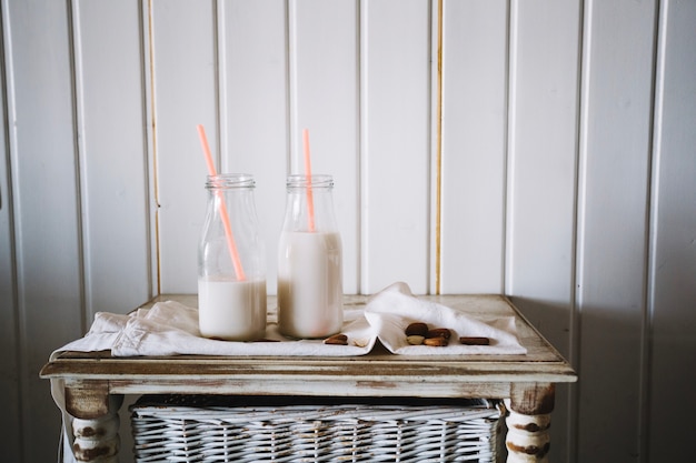 Milk bottles in morning composition