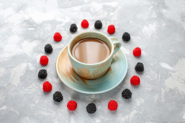 milk coffee with confiture berries on grey-white desk candy coffee sweet sugar