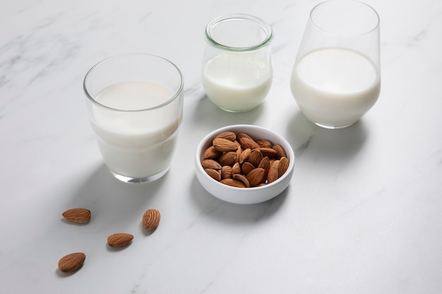 Milk day concept with almonds high angle