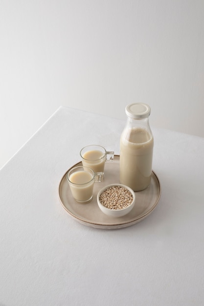 Milk day concept with seeds arrangement high angle