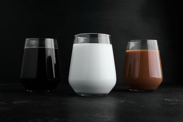 Free photo milk, espresso and hot chocolate in glass cups.