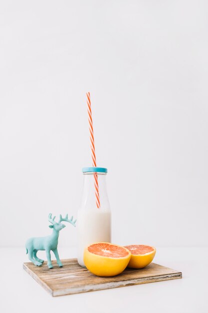 Milk, grapefruit and deer toy